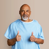 Patient doing a thumbs up hand gesture 