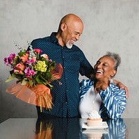 Senior woman celebrating her birthday with her husband 