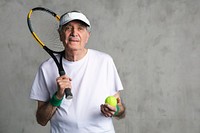 Cheerful senior tennis player wearing a visor cap 