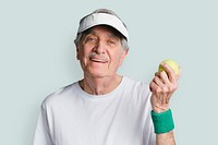 Cheerful senior man with a tennis ball