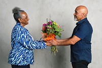 African American couple celebrating an anniversary together with flowers
