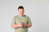 Cute boy with down syndrome using a mobile phone 