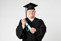 Cute boy with down syndrome in a graduation gown 