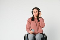Cool woman in a wheelchair listening to music