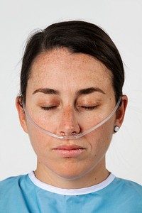Sick female patient with a nasal cannula