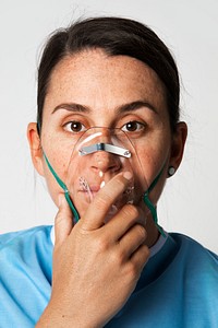 Sick female patient with an oxygen mask