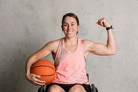 Basketballer in a wheelchair flexing her arms