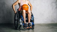 Female athlete in a wheelchair with a basketball 