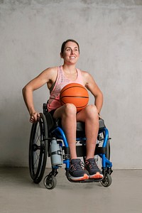 Female athlete in a wheelchair with a basketball 