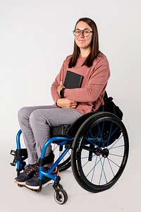 Cool woman in a wheelchair with a black book