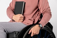 Cool woman in a wheelchair with a black book