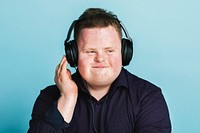 Cool young man with Down Syndrome listening to a sport podcast