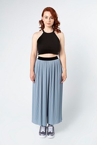 Woman wearing a crop top and skirt pants 