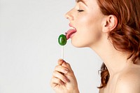 Beautiful woman enjoying a lollipop