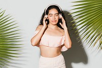 Woman listening to music through her headphones