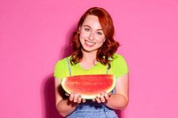 Happy woman holding a slice of watermelon 