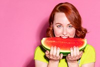 Woman biting into a slice of watermelon