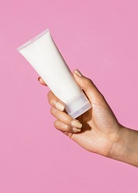 Woman holding a cream tube