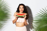 Happy woman holding a slice of watermelon 