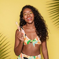 Happy black woman having an ice pop