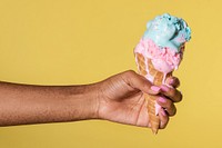 Hand holding a melting ice cream