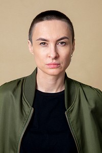 Serious skinhead woman in studio shoot