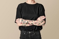 Tattooed model in black t shirt and jeans mockup