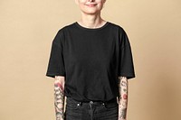 Model with tattoo in black T shirt