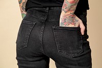 Model with tattoo in black T shirt and jeans mockup