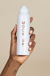 Black woman holding a white spray bottle psd mockup