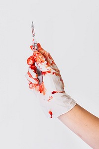 Doctor bloody hand in glove holding a scalpel