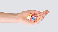 Hand taking pills treatment isolated