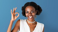 Happy black girl showing an ok hand gesture