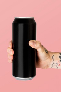Hand holding a black aluminum can 