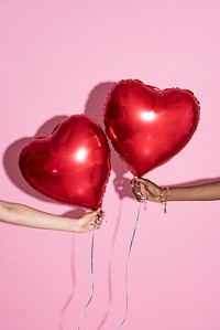 Red balloons on a pink background 