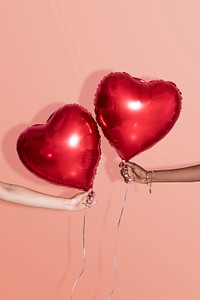 Red heart balloon mockups on a peach background 