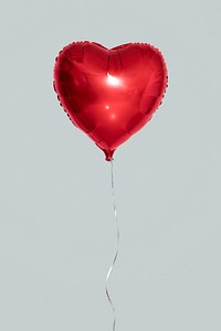 Heart shaped balloon on a gray background