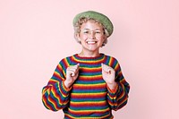 Happy lesbian woman with rainbow sweater on a pink wall mockup