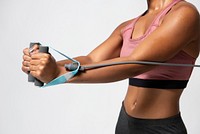 Black woman using resistance band for workout 