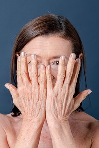 Close up of a senior woman with aging hands