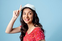 Cheerful Asian woman isolated on blue background