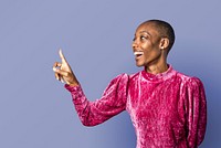 Black woman in a pink dress pointing forward 