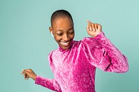 Black woman dancing with wireless earphones 