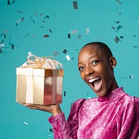 Happy black woman holding a gift box