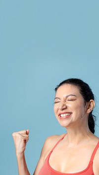 Happy woman in sportswear mobile wallpaper