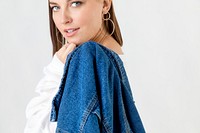 Young woman holding her denim jacket