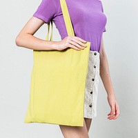 Woman with a yellow tote bag
