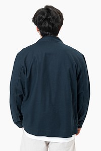 Man in simple navy jacket portrait street fashion rear view