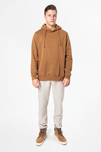 Trendy man in brown hoodie street fashion full body