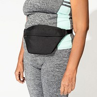 Black fanny bag on active woman's hip